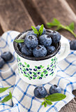 Fresh blueberry in the mug