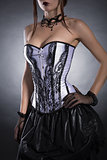 Elegant woman in black and white corset 