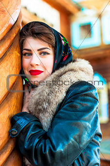 Russian girl with a fur collar smiling