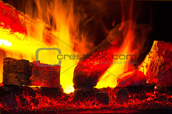 burning down fire logs in macro photography