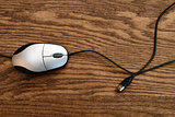 Computer mouse on wooden surface