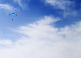 Silhouette of skydiver at sky