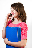 Attractive teenage girl talking on the phone. All on white background