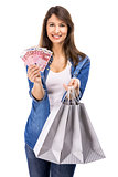 Woman with money and shopping bags