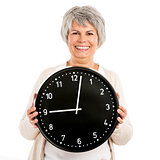 Elderly woman holding a clock