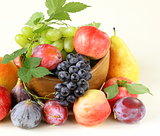 assortment autumn harvest fruit (grapes, figs, apples, plums)