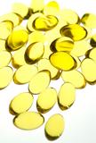 Close up of gel capsules conatining high concentrate fish oil rich in essential fatty acids.