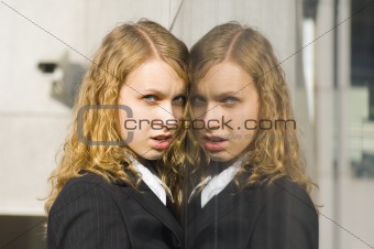 Business woman's portrait with reflection