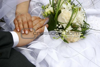 just married - hands, rings, bouquet