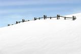 fence on snowy hill
