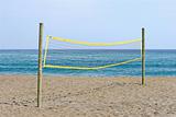 Volleyball net on sandy beach in Spain