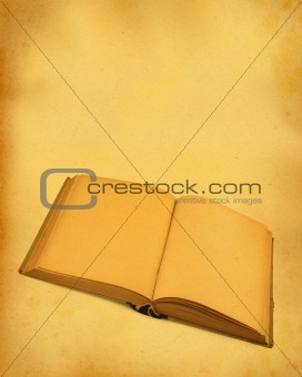 open blank book against stained dirty paper