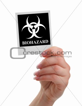 hand holding biohazard warning