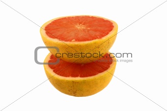 Isolated pink grapefruit halves on white
