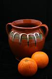 ceramic pot and oranges