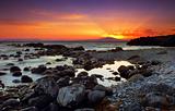Glorious sunset over rocky seascape