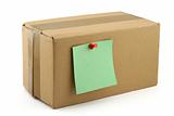 cardboard box with pinned note