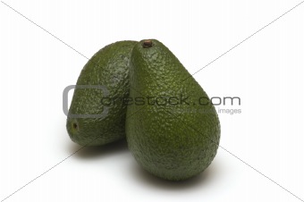 two fresh avocado on white background
