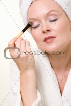 Putting on makeup