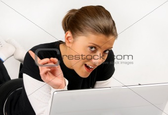 women lying with laptop