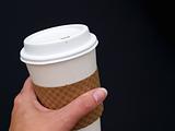 holding coffee cup