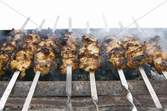 meat kababs on grill isolated over white