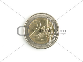 two euro coin worn on white