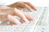 fingers on the computer keyboard