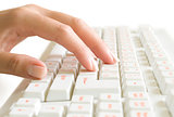 hand on the computer keyboard