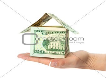 House made of money set on a white background