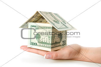 House made of money set on a white background