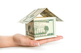 House made of money on white background