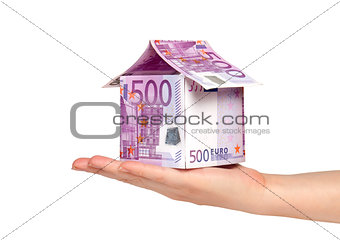 House made of money on a white background