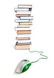 computer mouse on stack of books