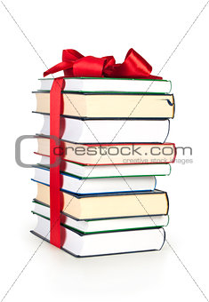 stack of book with ribbon like a gift isolated on white