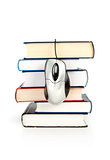 computer mouse with stack of books