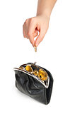 Hand throwing coin in purse on white background