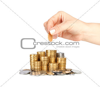 Stack of coins and hand
