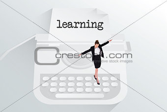 The word learning and businesswoman performing a balancing act