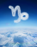 Composite image of cloud in shape of capricorn star sign