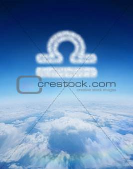Composite image of cloud in shape of libra star sign
