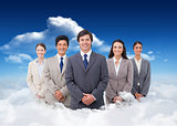 Composite image of smiling salesteam standing