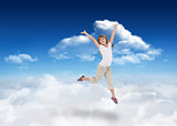 Composite image of happy girl jumping