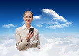 Composite image of laughing stylish businesswoman holding smartphone