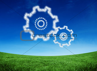 Composite image of cloud in shape of cogs and wheels