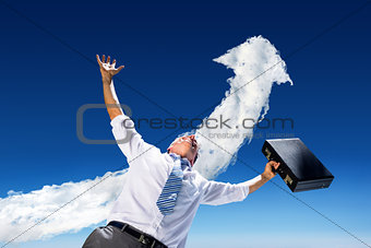 Composite image of businessman holding briefcase and cheering