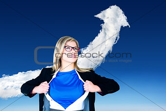 Composite image of businesswoman opening her shirt superhero style