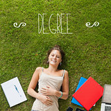 Degree against pretty student lying on grass