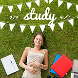 Study against pretty student lying on grass