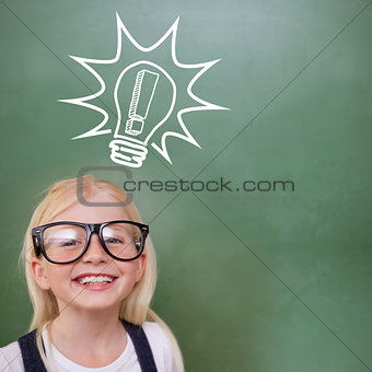 Composite image of cute pupil smiling